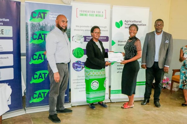 Our Field Officer being awarded a Certificate after attending a Legume Post-Harvest Training Workshop facilitated by the Centre for Agriculture Transformation (CAT), Kasungu, Feb. 2024